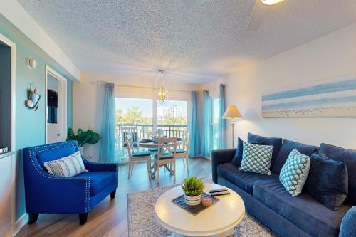 a living room with a couch and a table at Gulf Strand Resort 308 in St. Pete Beach