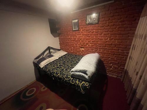 Cama o camas de una habitación en Aarogya Hostel and Restaurant