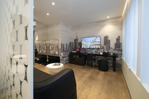 a room with a bar with a view of a city at The Street Milano Duomo | a Design Boutique Hotel in Milan