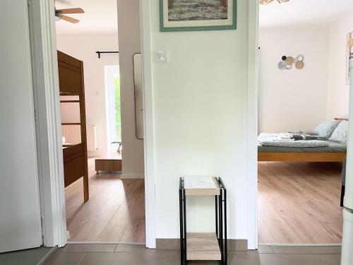 a living room with a bed and a table at Quiet, green, relaxing place - 2 bedroom apartment in Balatonfüred