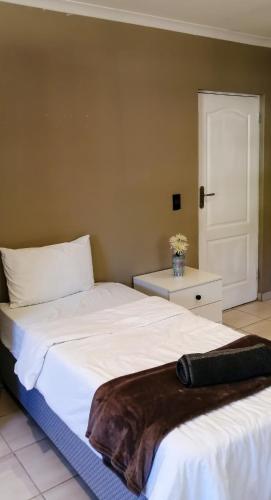 two beds sitting next to each other in a room at STAY In TEHAMA in Cape Town