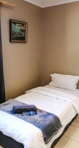 two beds sitting next to each other in a room at STAY In TEHAMA in Cape Town
