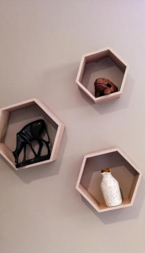 three boxes with figurines of a horse and a vase at STAY In TEHAMA in Cape Town