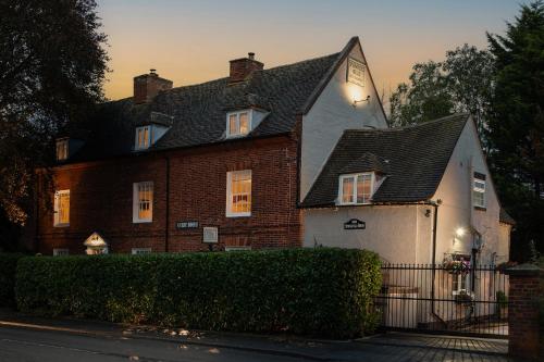 a large brick house with a clock on it at Springfield House - Birmingham Airport & NEC in Coleshill