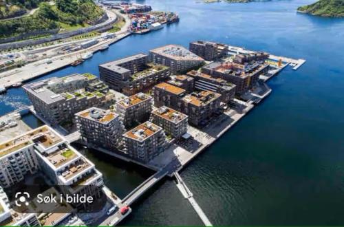 an aerial view of a city with a harbor at Extravagant villa central & by the sea in Oslo