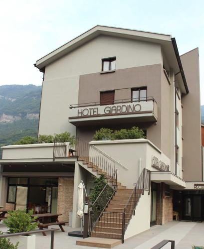 a building with a hotel grongo on the side at Hotel Giardino in Breno