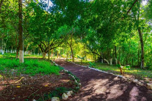 a dirt road in a park with trees at Hotel Colonial Iguaçu in Foz do Iguaçu