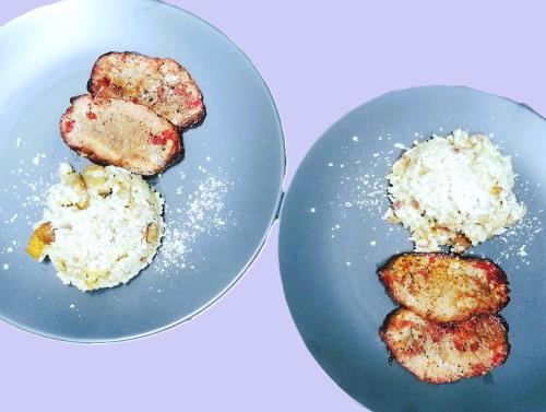 two plates of food on a white table at Voinescu House - Natural Living & Eating in Şimon