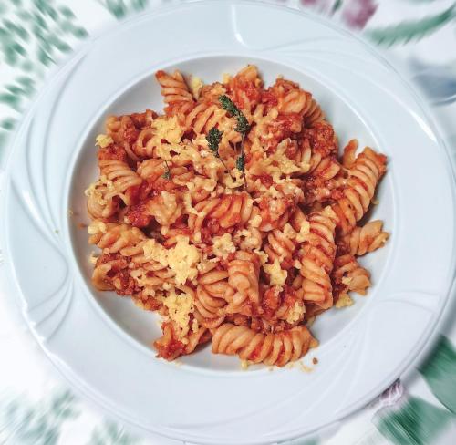 a plate of pasta on a white plate at Voinescu House - Natural Living & Eating in Şimon