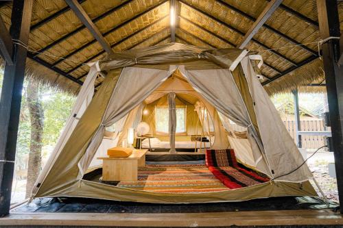 a tent with a bed in the middle at iRETREAT Jungle Bliss, Pa Pae in Ban Pa Pae