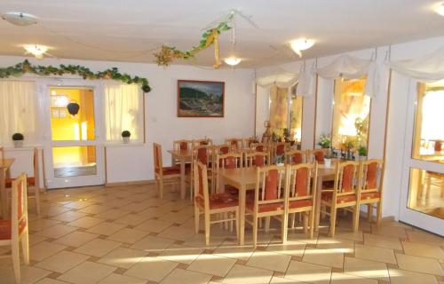 a dining room with a table and chairs at Family Apartments Spiežovec in Donovaly