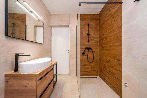 a bathroom with a sink and a shower at Villa Ivan in Pridraga