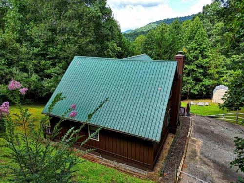 a building with a green roof in a yard at Copper Valley in Blairsville
