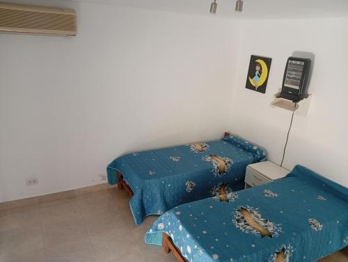 En eller flere senge i et værelse på Lo de Cheo