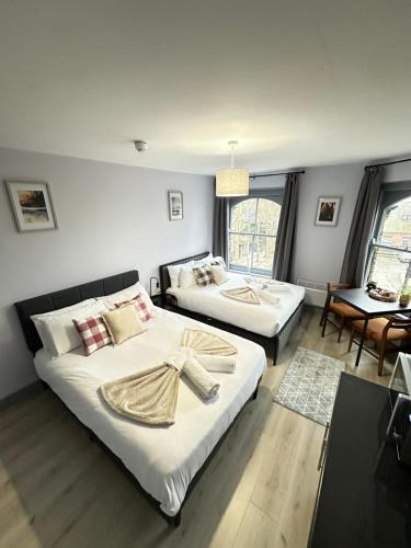 Postel nebo postele na pokoji v ubytování The Wolfs Tavern