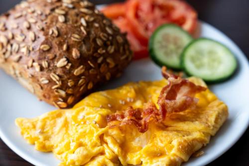 a plate of food with an omelet and vegetables at Best Western Hotel Heide in Oldenburg