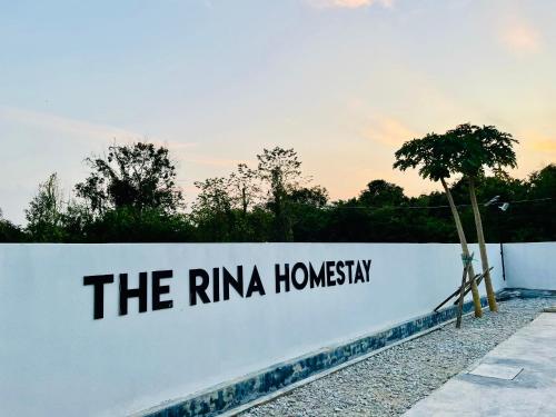 a white wall with the riniha homani written on it at The Rina Homestay-Whole Villa with Private Pool,BBQ & Karaoke-Near Beach- in Port Dickson