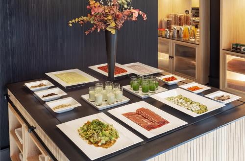 a buffet with different types of food on a table at Francisco I Boutique in Madrid