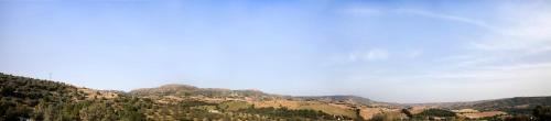 a view of a mountain range with clouds in the sky at Agriturismo Giannavi in Palazzolo Acreide