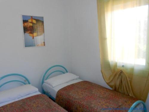 Postel nebo postele na pokoji v ubytování Federica