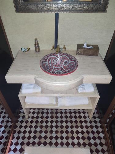 a sink in a bathroom with a counter top at Erg Chebbi Star Camp in Merzouga