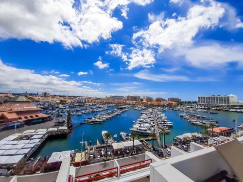 a view of a marina with boats in the water at Penthouse Triplex L25 T2 by HsR Vilamarina in Vilamoura