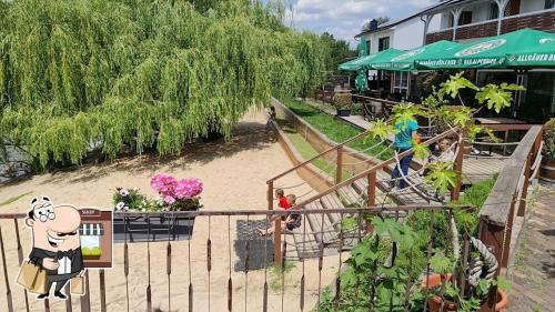 an outdoor playground with people on a roller coaster at Havelpension in Rathenow