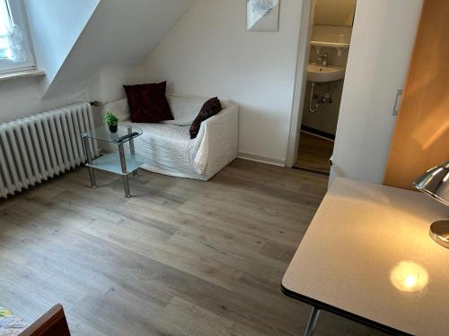 a living room with a couch and a table at Hotel Haus Schwan Köln in Cologne