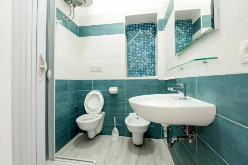 a bathroom with a toilet and a sink at Residence Family House in Vieste
