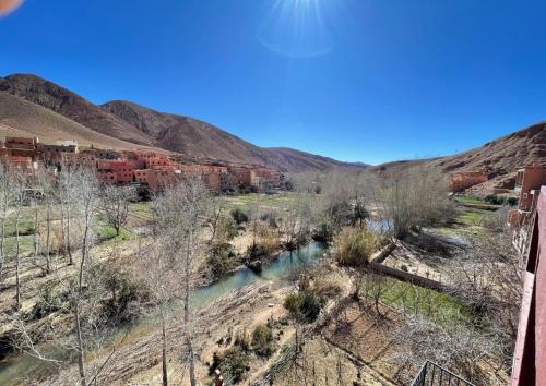 an aerial view of a river with mountains in the background at AUBERGE DE LA RIVIÈRE Du DADÈS in Boumalne