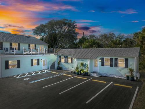 a house with a parking lot in front of it at Cozy Condo in Sebastian in Sebastian