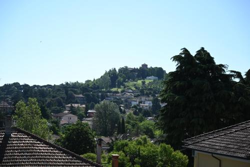 a view of a town with houses and trees at La Garampa in Cesena