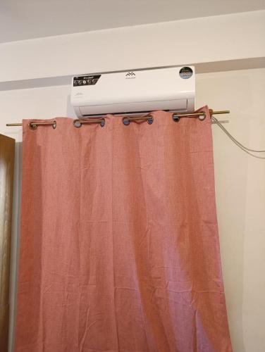a projector is on top of a curtain at Hospedaje Turisticos. in Libertador General San Martín