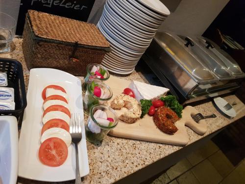 a plate of food with meat and vegetables on a counter at Hotel Landgasthof Hirsch in Marktlustenau