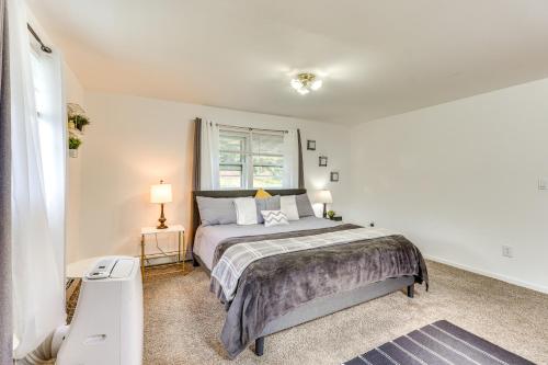 a bedroom with a bed and a window at Peaceful 1-Acre Parksville Home Large Deck and Yard in Parksville