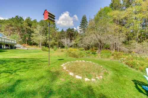 a kite in the middle of a yard at Peaceful 1-Acre Parksville Home Large Deck and Yard in Parksville