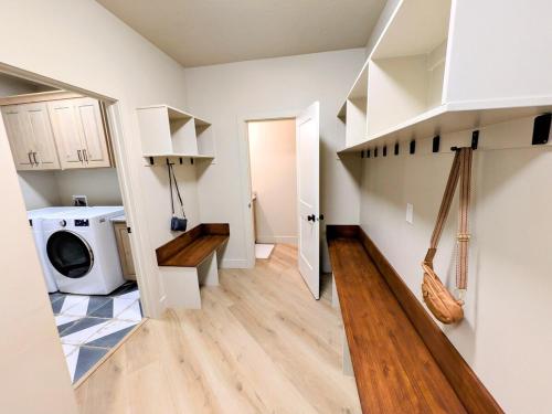 a laundry room with a washer and dryer at BRAND NEW World Adventure at Aspen Crest in Beaver