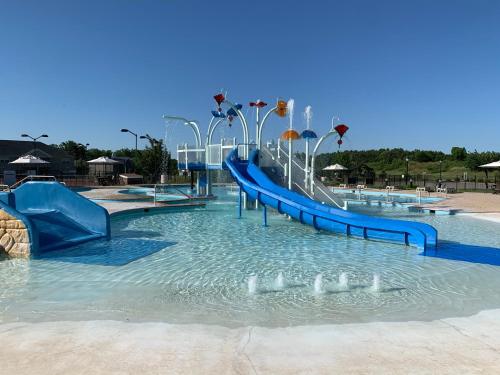 a water park with a slide in the water at The Colonies at Williamsburg in Williamsburg