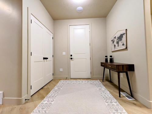 a room with a door and a table and a desk at BRAND NEW World Adventure at Aspen Crest in Beaver