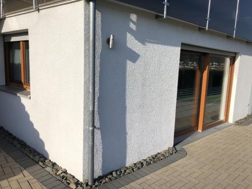 a wall of a building with a door at Ferienwohnung Wiesenblick in Plettenberg