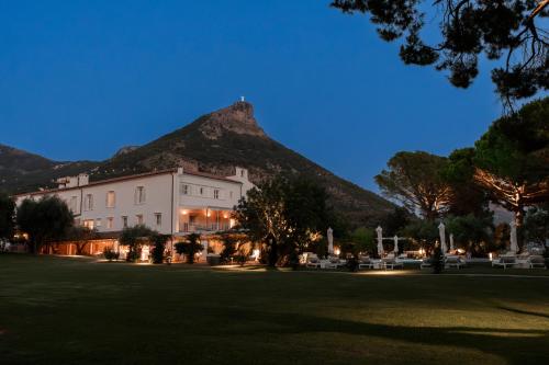 a view of a building with a mountain in the background at Santavenere Hotel in Maratea