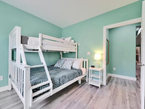 a bedroom with two bunk beds in a room at Timeless Hive in Parowan