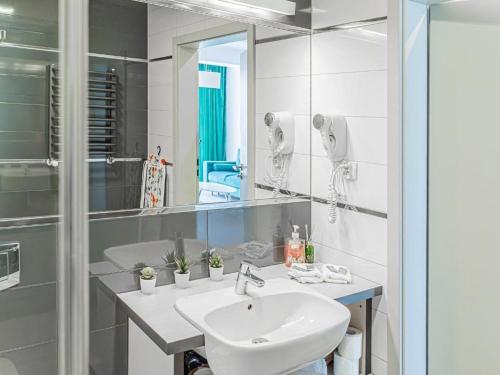 a bathroom with a sink and a mirror at Bormio 27 Czarna Góra in Sienna