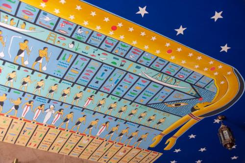 a large board game with people on it at Thebes Hotel in Luxor