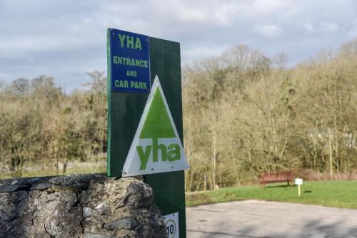 a sign for a car park in a park at Ingleton Hostel in Ingleton 