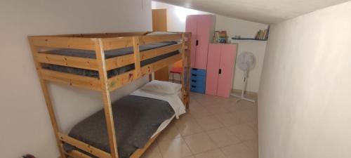 a room with two bunk beds in a room at Appartamento Sofia in Montesilvano