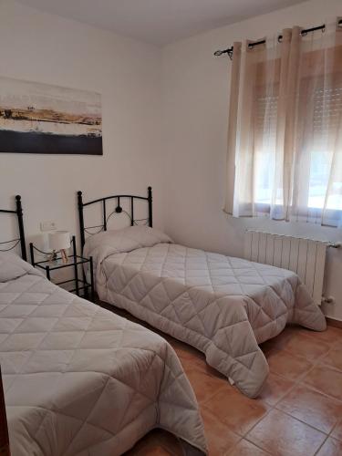 Ένα ή περισσότερα κρεβάτια σε δωμάτιο στο Cortijo Ojos del Prado