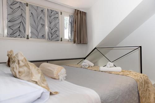 a bedroom with two beds and a window at Central Split rooms and apartments Paese in Split