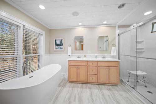 a large bathroom with a tub and a shower at Tree Top in Banner Elk
