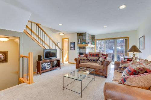 a living room with couches and a tv at Airy Winter Park Gem with Private Outdoor Hot Tub! in Winter Park